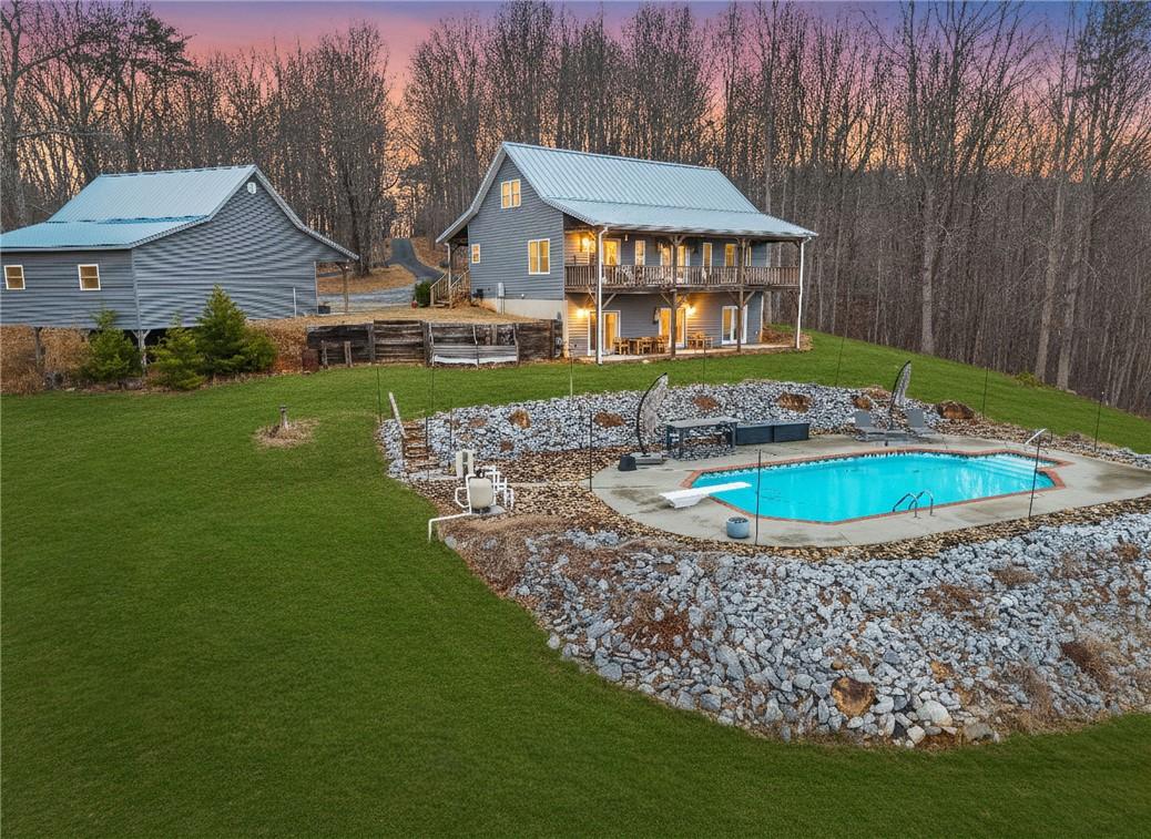 Image 1: This tranquil property features a private swimming