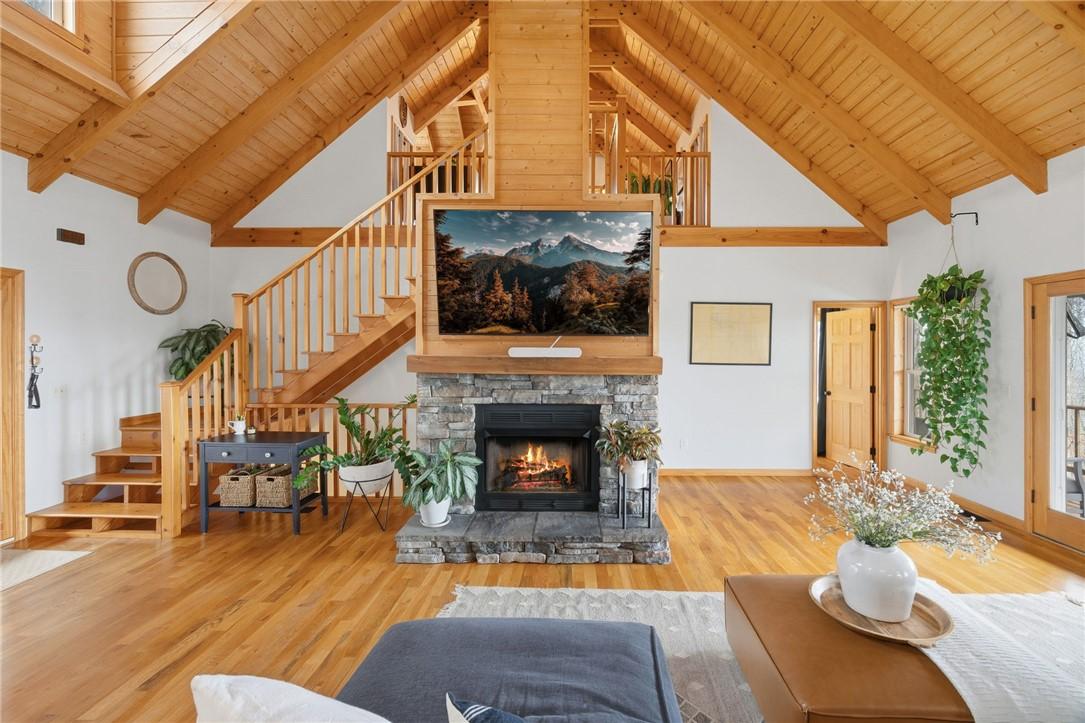 Image 3: This expansive living area features striking vault