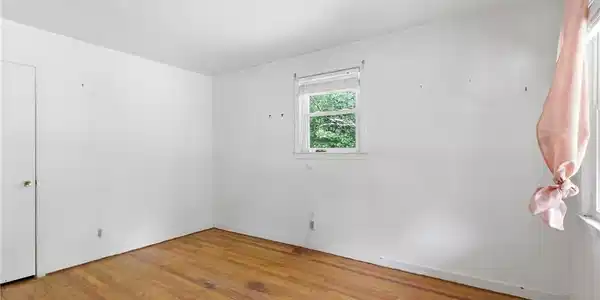 Image 4: Primary Bedroom opens to back porch.