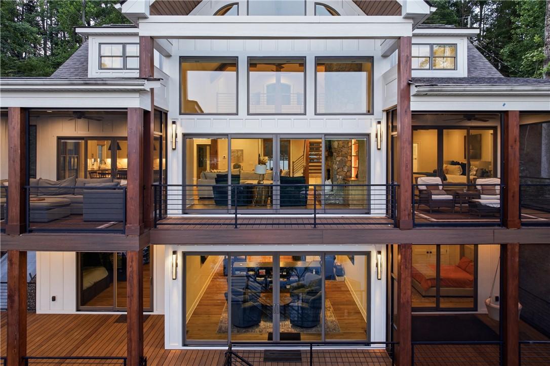 Image 3: A striking modern facade featuring expansive windo