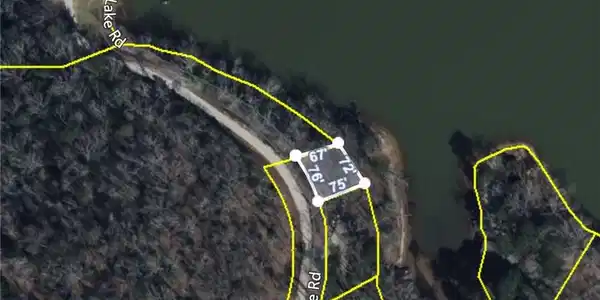 Image 2: A prime lakefront lot awaits, offering direct acce